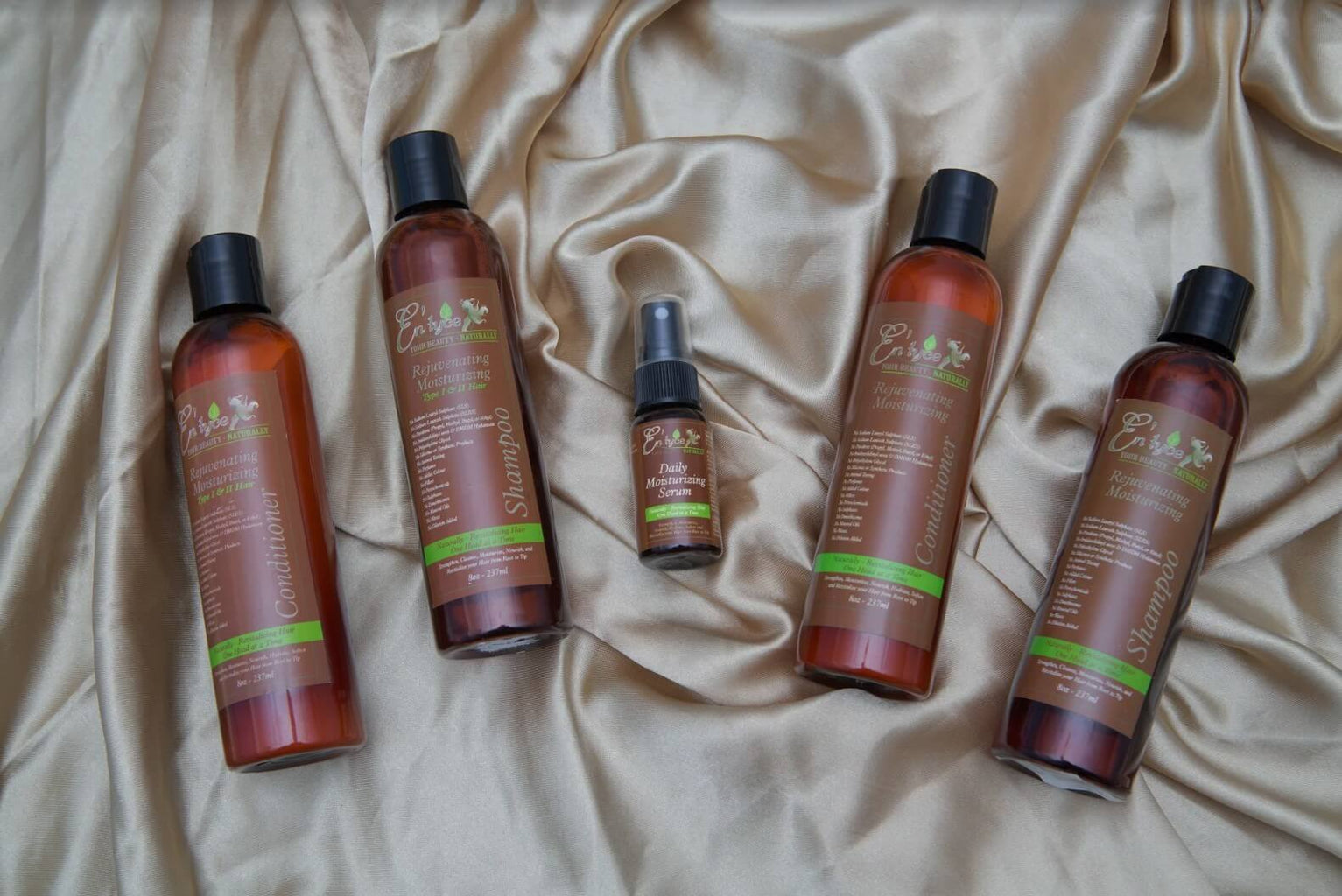 Set of hair care products on a beige fabric background