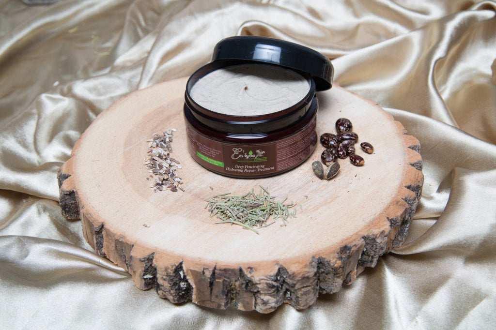 Deep Penetrating Hydrating Repair Treatment handmade plant-based herb-infused medicinal luxury hair care - open jar with herbs on wooden plank